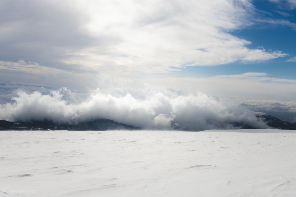 Mountain Peak White Clouds & Snow Stock Photo