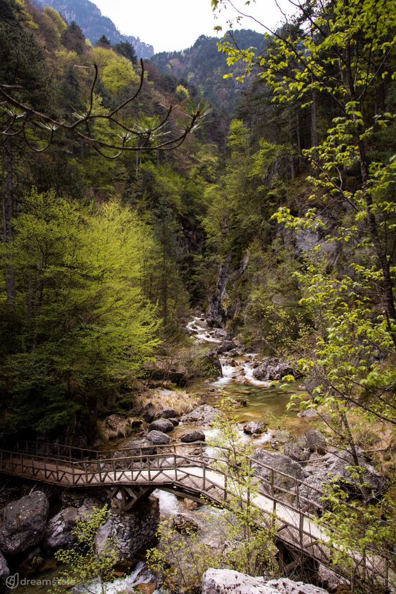 River & Wooden Bridge on Mount Olympus Stock Photo